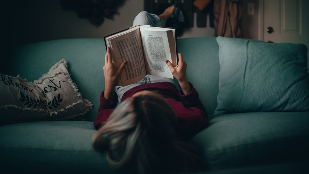 reading english classics on sofa